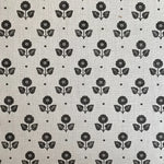 Black floral pattern on a light gray background