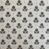 Black floral pattern on a light gray background