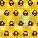 Detail of wallpaper in a repeating lion face print on a geometric field in shades of tan, brown and yellow.