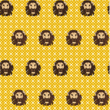 Detail of wallpaper in a repeating lion face print on a geometric field in shades of tan, brown and yellow.