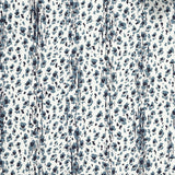 Close up of wallpaper with small scale painterly animal print in light and dark blue on white.