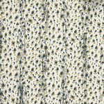 Close up of wallpaper with small scale painterly animal print in tan and dark green on white. 