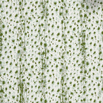 Close up of wallpaper with small scale painterly animal print in light blue and green on white. 