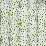 Close up of wallpaper with small scale painterly animal print in light blue and green on white. 