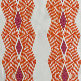 Detail of fabric in an intricate diamond stripe print in orange and pink on a cream field.