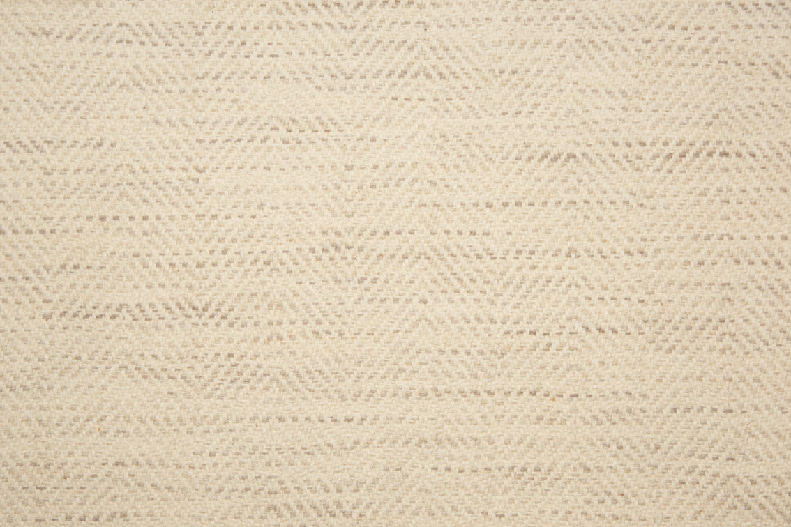 Broadloom carpet with herringbone weave in cream blended with oatmeal. 