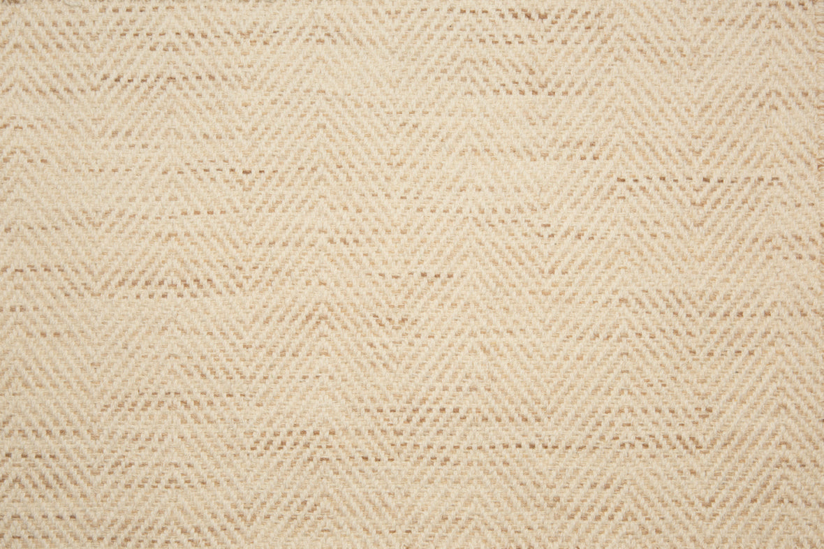 Broadloom carpet with herringbone weave in cream blended with warm tan. 