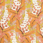 Detail of wallpaper in a painterly floral print in shades of white, yellow and orange.