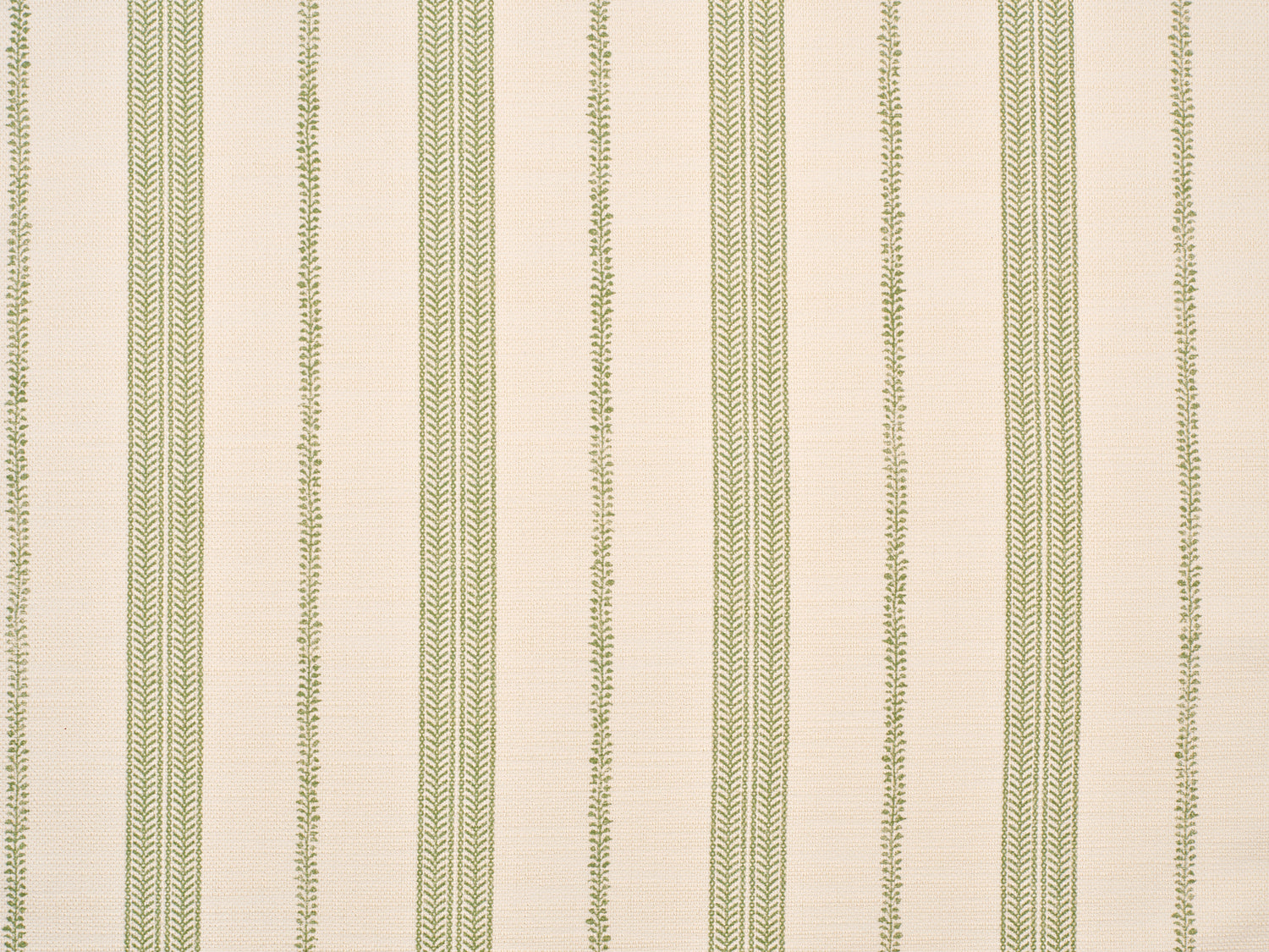 Detail of fabric in a small-scale botanical stripe print in green on a cream field.