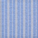 Detail of fabric in a small-scale botanical stripe print in cream on an indigo field.