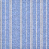 Detail of fabric in a small-scale botanical stripe print in cream on an indigo field.