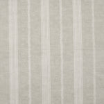Detail of fabric in a small-scale botanical stripe print in cream on a tan field.