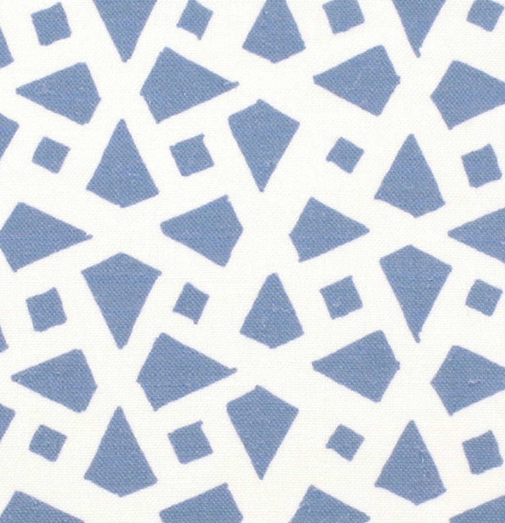Detail of fabric in a geometric lattice print in blue on a white field.