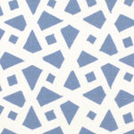 Detail of fabric in a geometric lattice print in blue on a white field.
