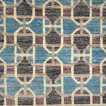 Patterned rug with geometric design in blue, brown, and beige colors.