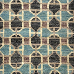 Patterned rug with geometric design in blue, brown, and beige colors.
