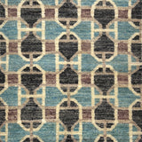 Patterned rug with geometric design in blue, brown, and beige colors.