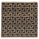 A square area rug with a geometric maze-like pattern in black and tan, finished with a fringed edge.