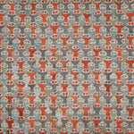 Patterned rug with red and gray design on a gray background