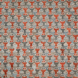 Patterned rug with red and gray design on a gray background