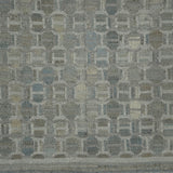 Textured fabric with a geometric pattern in shades of gray.