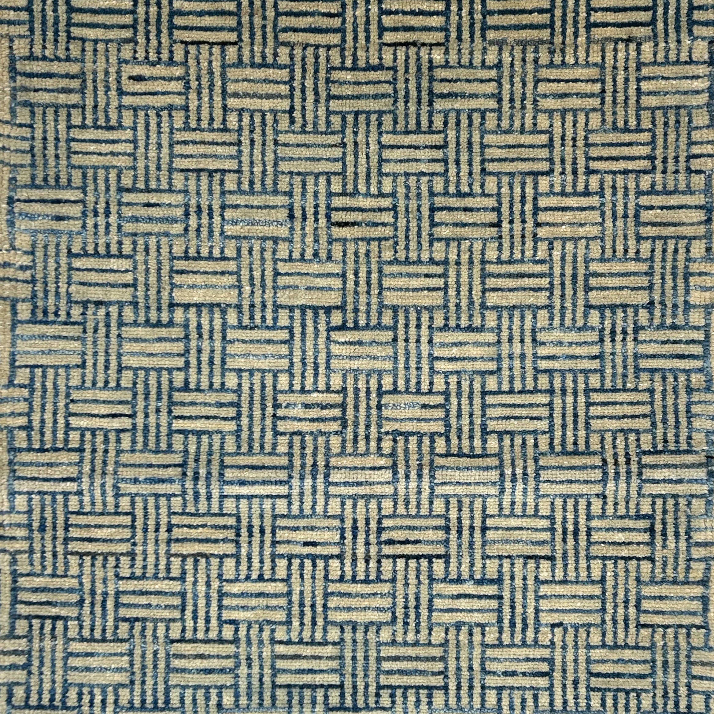 Handknotted rug in a basketweave design in blue and grey. 