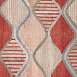 Patterned rug with red, beige, and gray geometric design