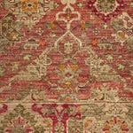 Decorative rug with intricate patterns in red, green, and beige on a plain background