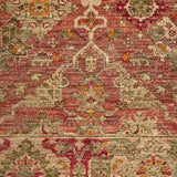 Decorative rug with intricate patterns in red, green, and beige on a plain background