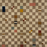 Checkered handknotted rug with multicolor squares on a beige background