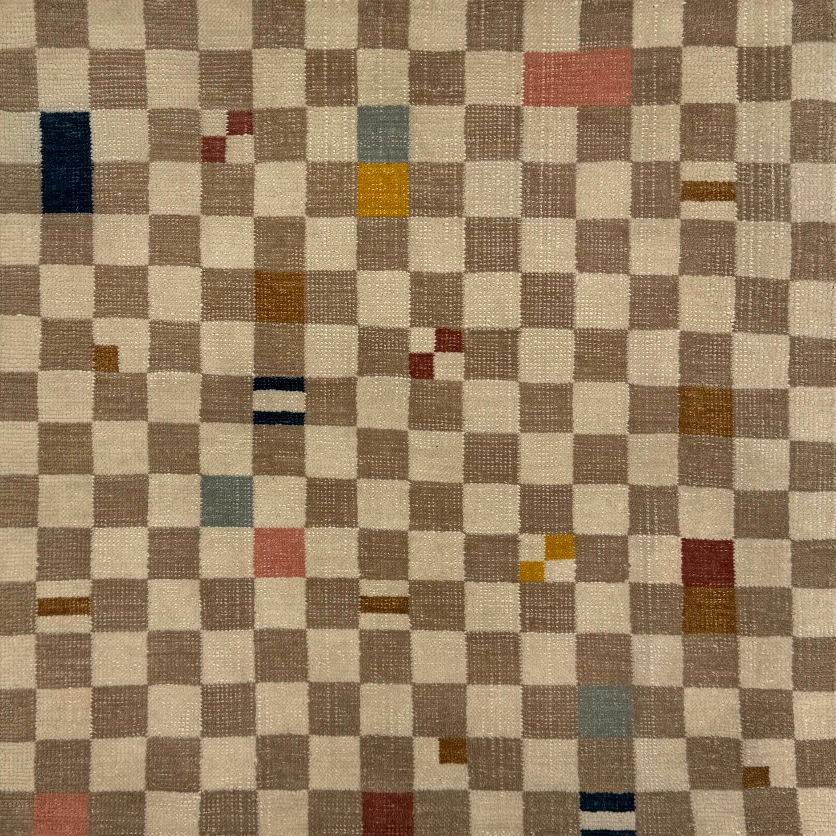 Checkered handknotted rug with multicolor squares on a beige background