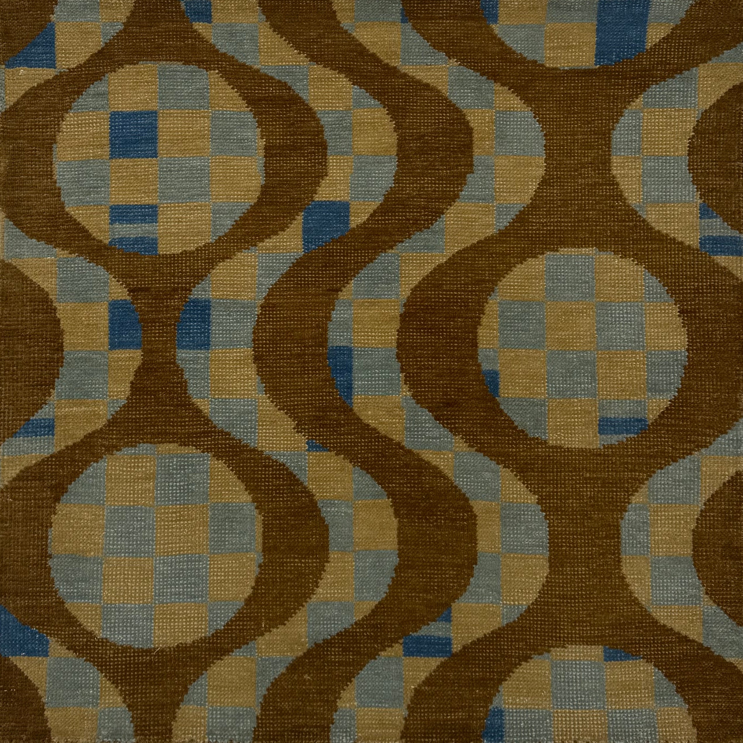 Handknotted rug with retro geo stripe in brown over a tan and blue checkerboard design. 