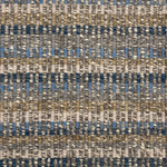 Handwoven rug detail in a textural design in blue, tan and cream