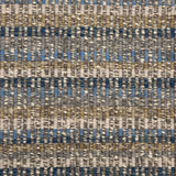 Handwoven rug detail in a textural design in blue, tan and cream