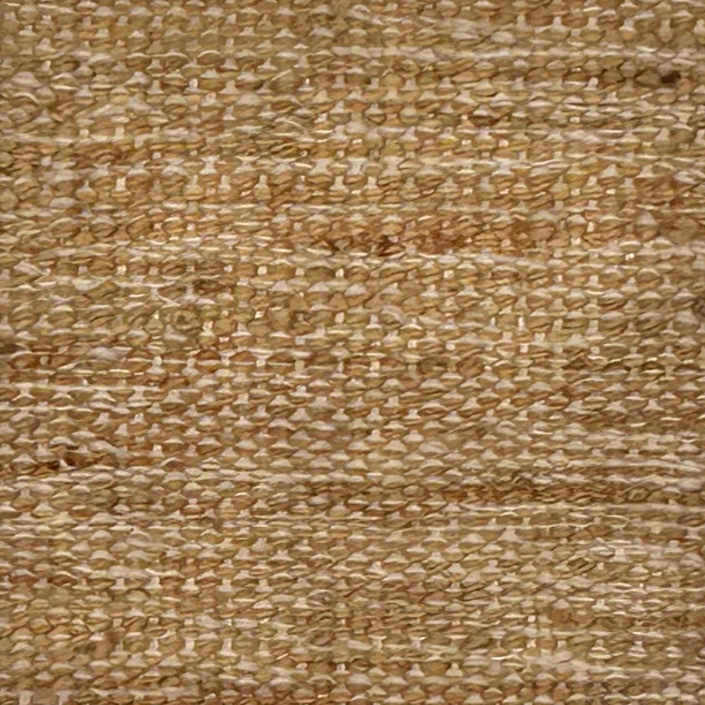 Close-up of a textured tan flatweave rug