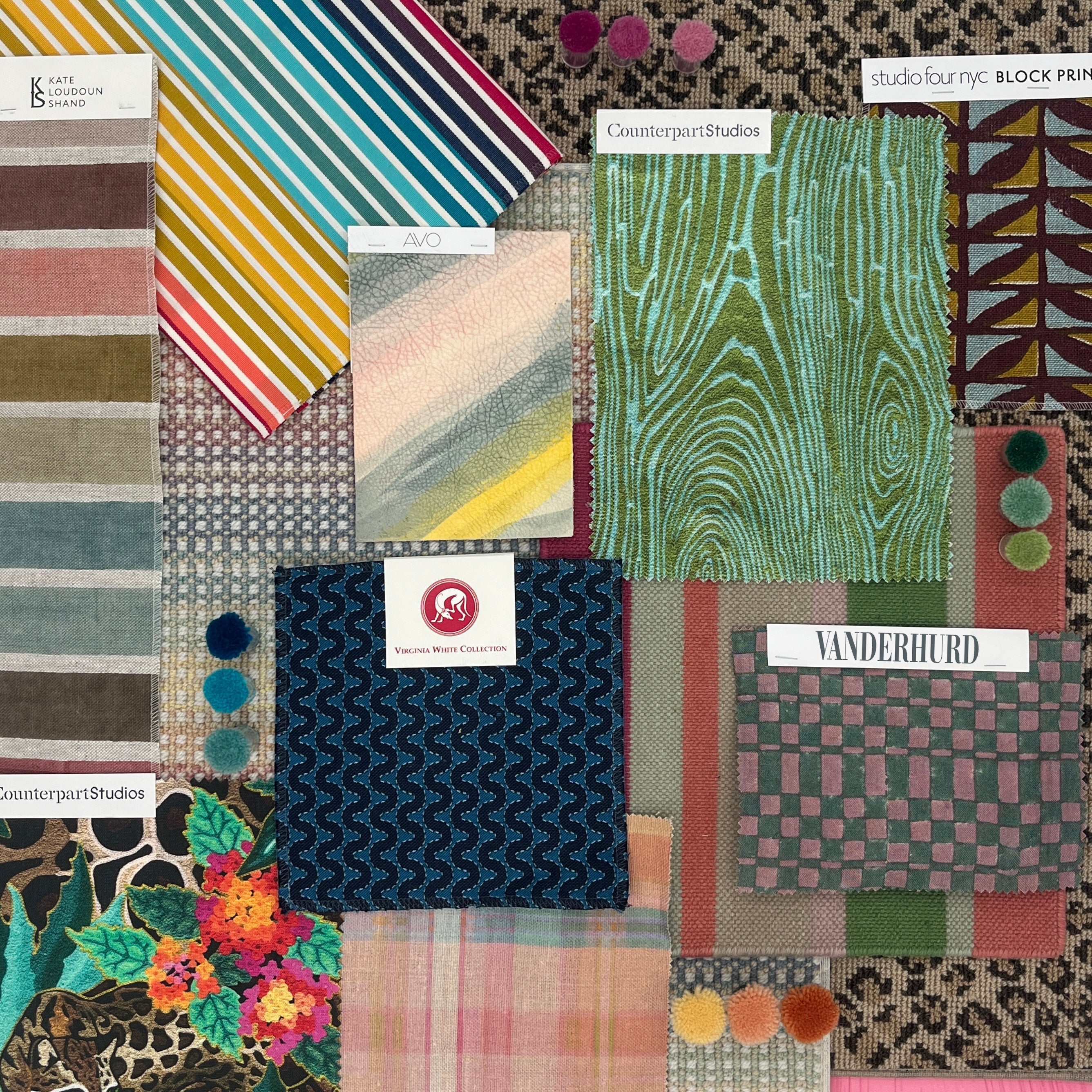 Collection of fabric swatches with various patterns in a rainbow palette. 