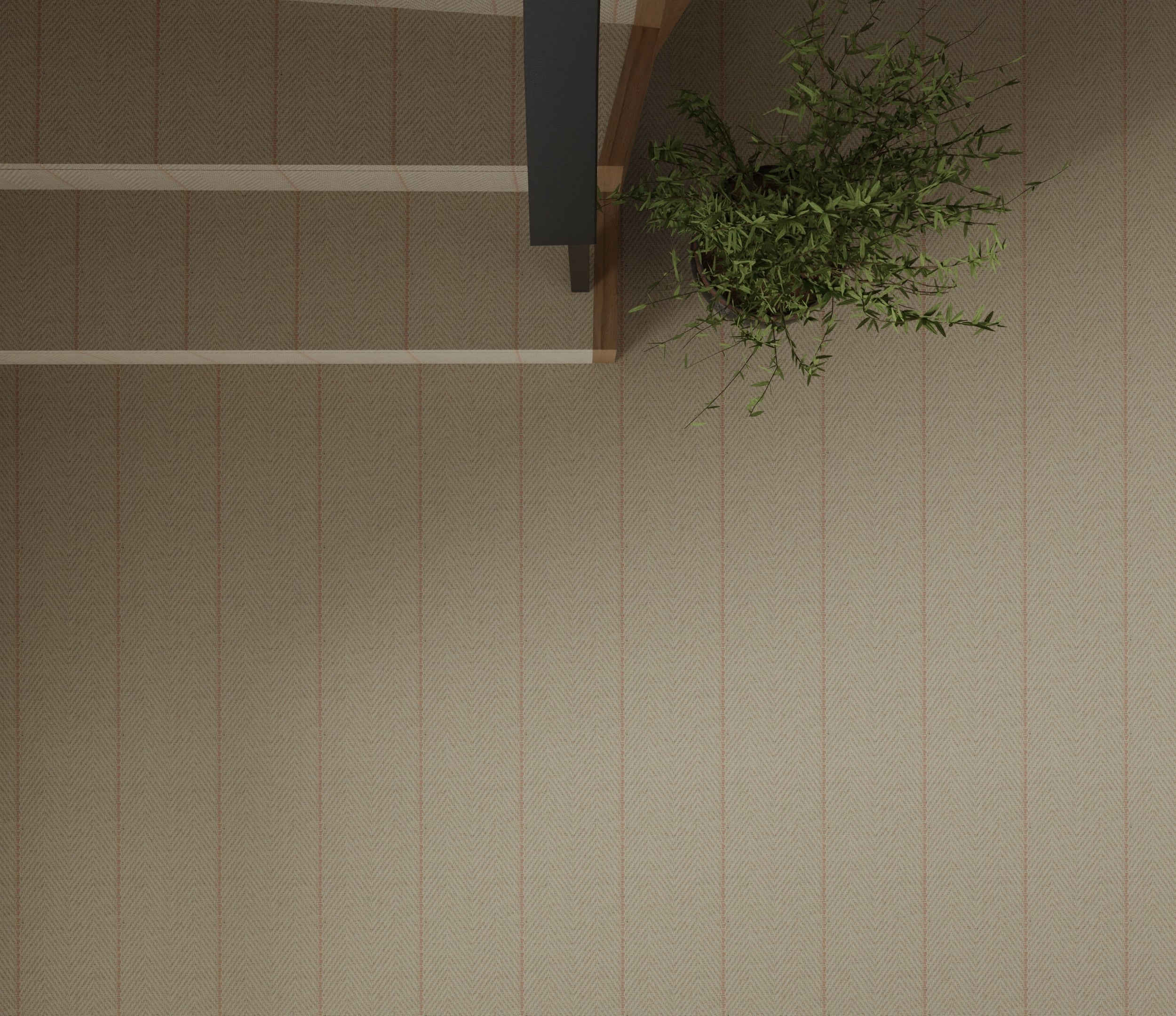 Overhead image of a staircase and landing with a potted plant  and wall to wall herringbone carpet in beige with pink accent stripes. 