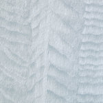 Detail of a wallpaper in an abstract textural pattern in metallic and blue.