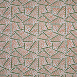 Printed fabric detail in a playful dot and line pattern in coral pink and green