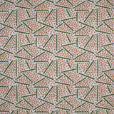 Printed fabric detail in a playful dot and line pattern in coral pink and green