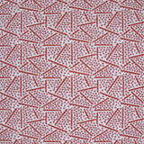 Printed fabric detail in a playful dot and line pattern in pink and cherry red