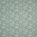 Printed fabric detail in a playful dot and line pattern in  acqua and grass green