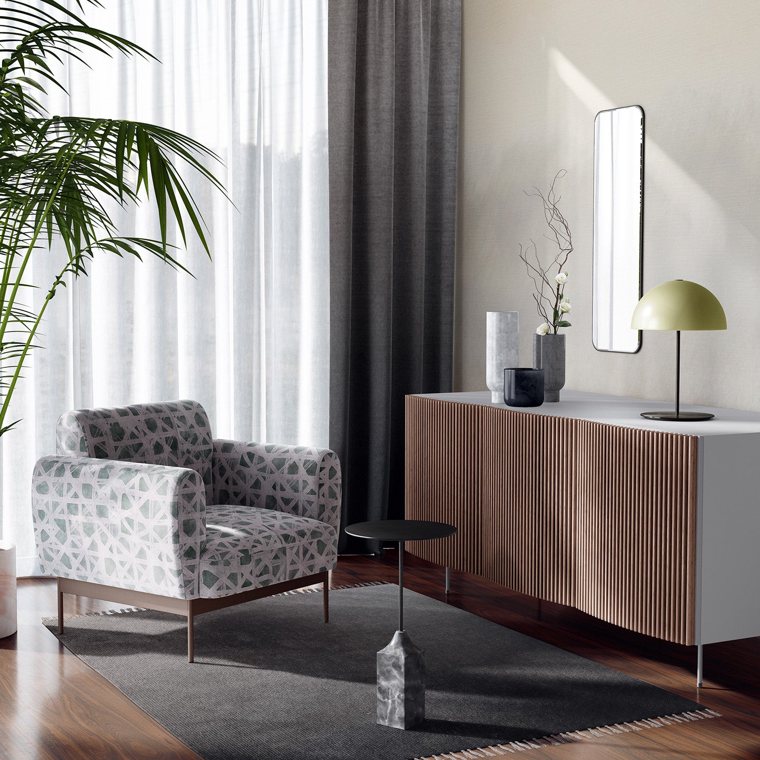 An airy modernist living space with an armchair upholstered in sage leather with a white lattice overlay.