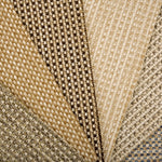 An array of broadloom carpet samples in textural neutral colors. 