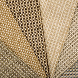 An array of broadloom carpet samples in textural neutral colors. 