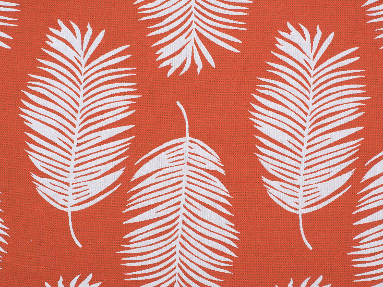 Palm print performance fabric in white on orange. 