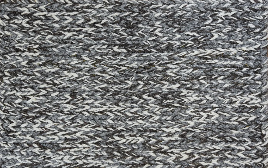 Broadloom carpet swatch in a textured pattern in a dark grey design