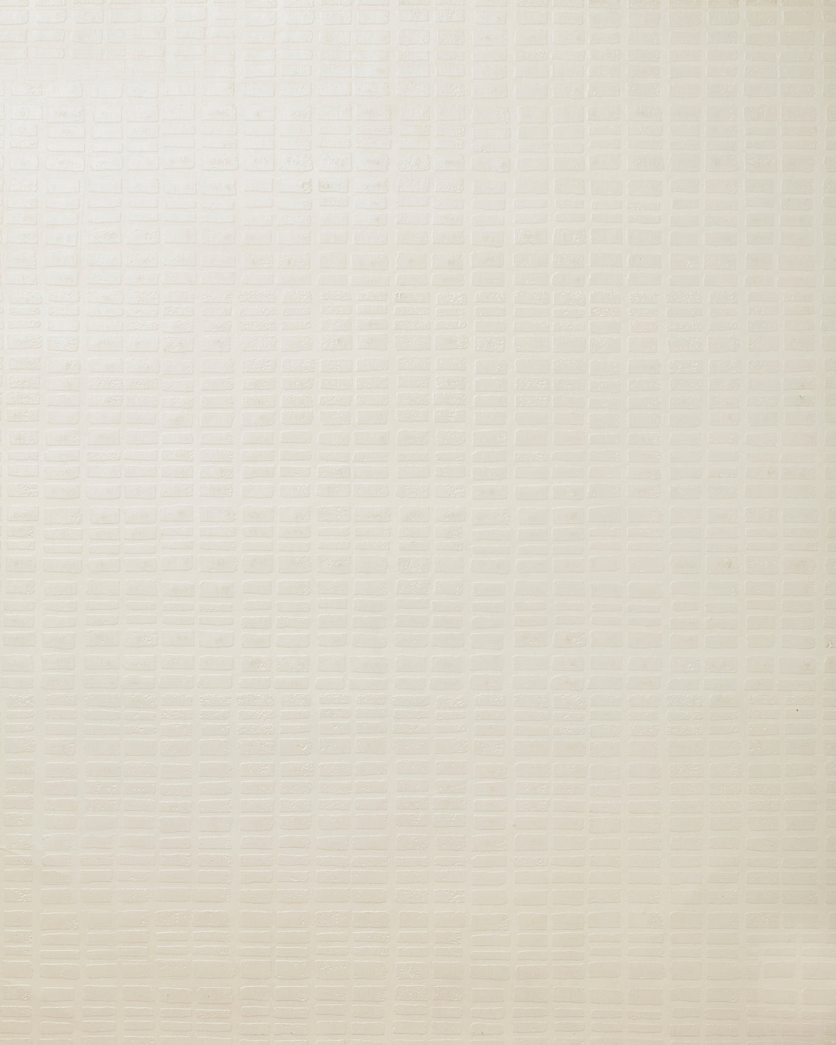 Detail of wallpaper in a grid print in cream.