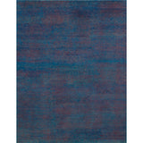 A full size rug with teal and red woven together.