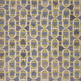 Patterned rug with geometric design in gray and yellow tones